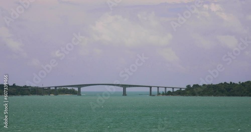 Preah Sihanouk Kaoh Puos Bridge Ocean View and Island in Cambodia. Medium Panning Shot. photo
