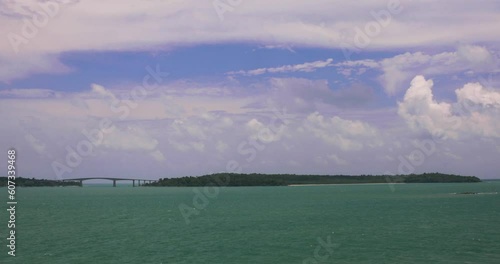 Preah Sihanouk Kaoh Puos Bridge Ocean View and Island in Cambodia. Wide Panning Shot. photo