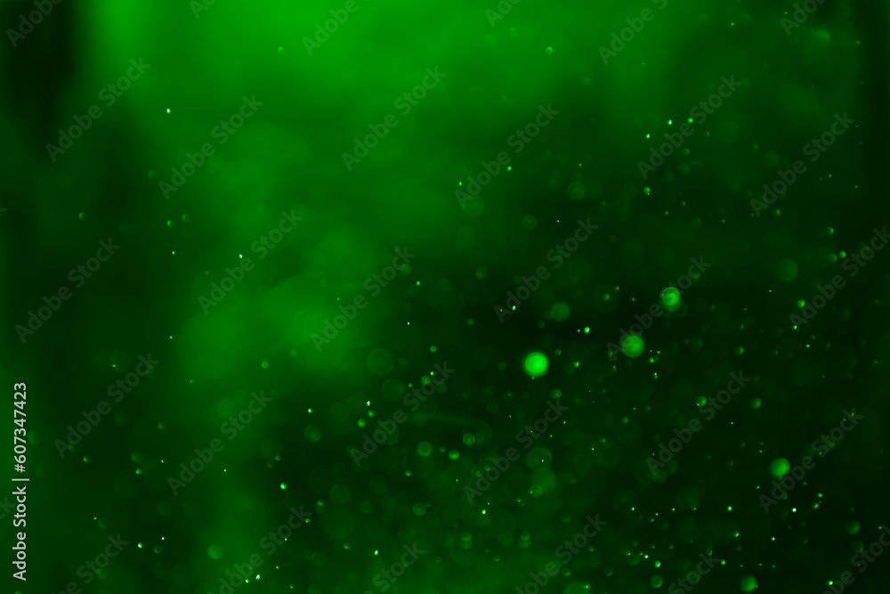 Obraz premium Abstract green blurred glitter shiny backdrop smooth background.