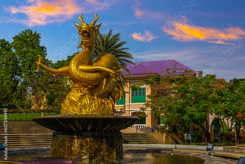Golden dragon in old phuket town phuket Thailand this dragon is on the middle of a big water pond and fountain Chinese Dragon