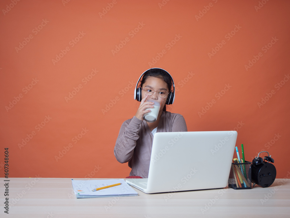 Cute little girl with laptop at table Cute little girl with laptop at table