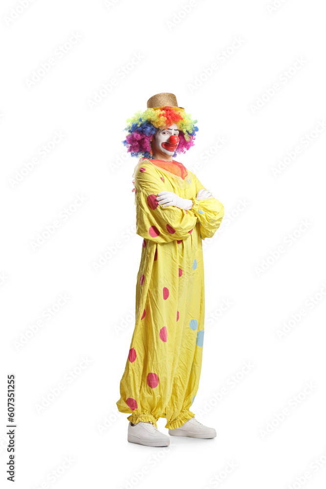 Clown in a yellow costume posing with folded arms Clown in a yellow costume posing with folded arms