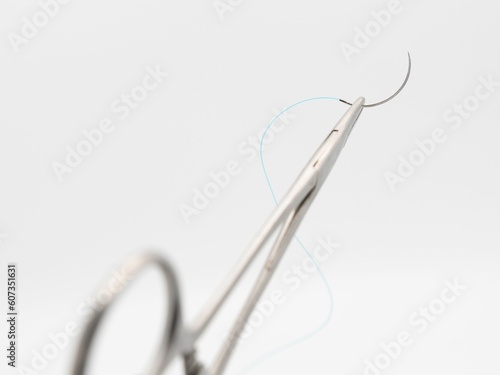 Fotografi Surgical needle and thread on suture scissors isolated on a white background