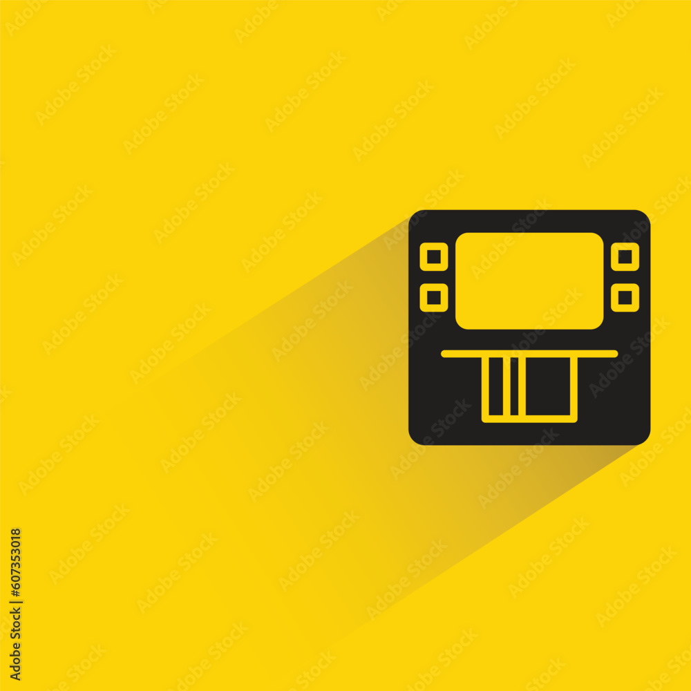atm money machine with shadow on yellow background atm money machine with shadow on yellow background