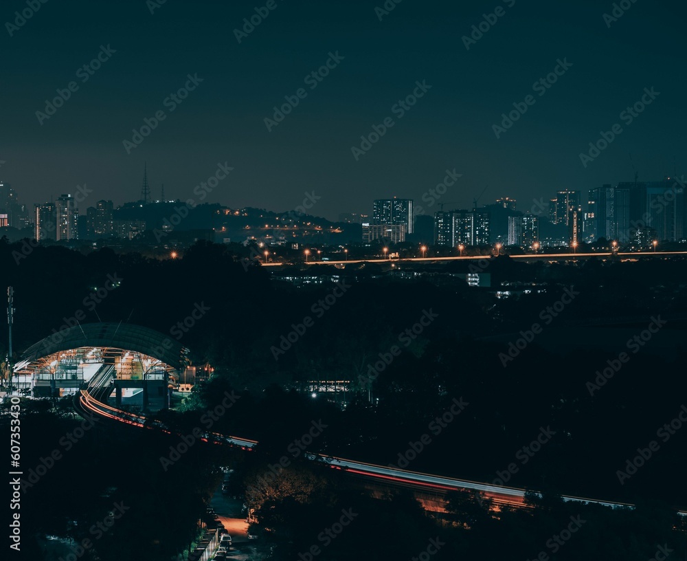 Night view of Bukit Jalil LRT Station with city lights in Kuala Lumpur, Malaysia