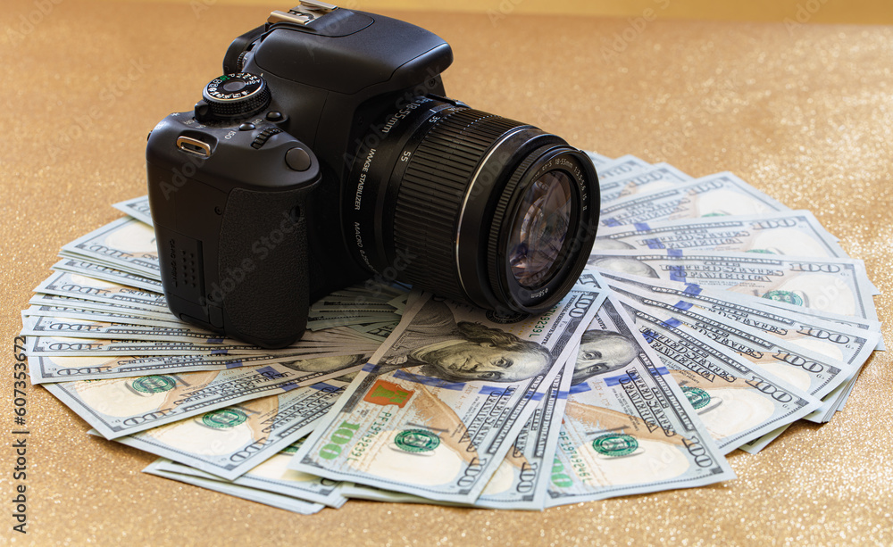 US 100 dollar banknote and photo camera