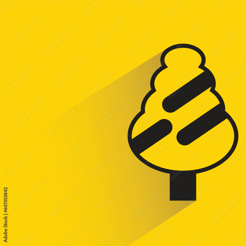 Christmas tree with shadow on yellow background Christmas tree with shadow on yellow background