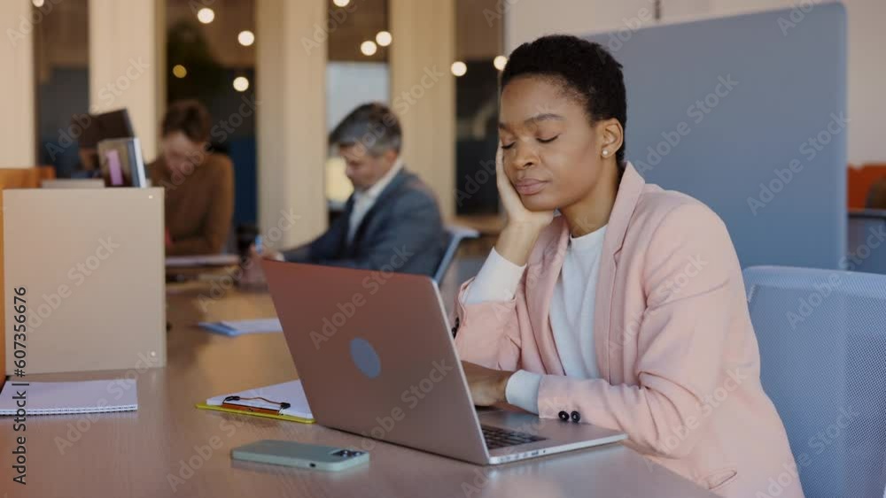 African american sleepy woman sleeping at her workplace. Tired and boring lady trying to work at coworking. Multiracial woman napping in business office. African american sleepy woman sleeping at her workplace. Tired and boring lady trying to work at coworking. Multiracial woman napping in business office.