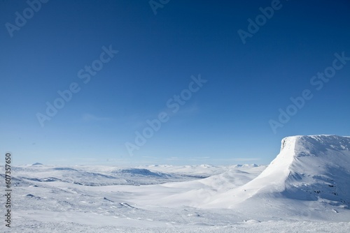 Aerial view of the mountains covered in snow