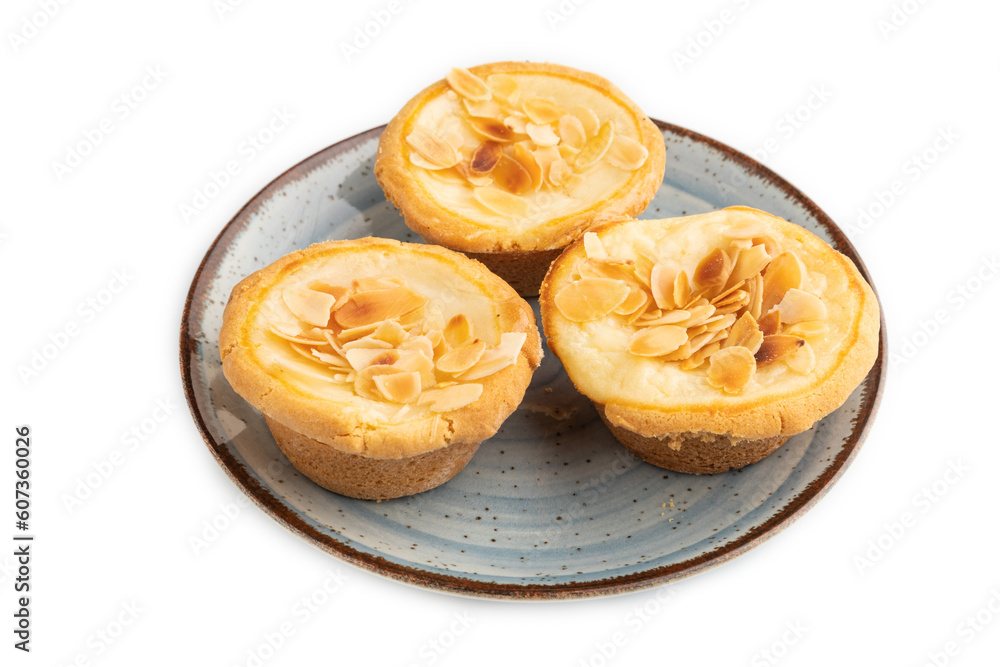 Traditional portuguese cakes pasteis de nata, custard small pies isolated on white. Side view.