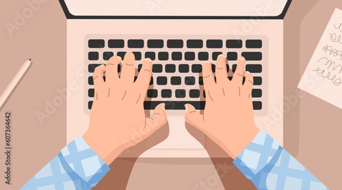 Hands at work behind a laptop keyboard with at the table. Workplace at home.