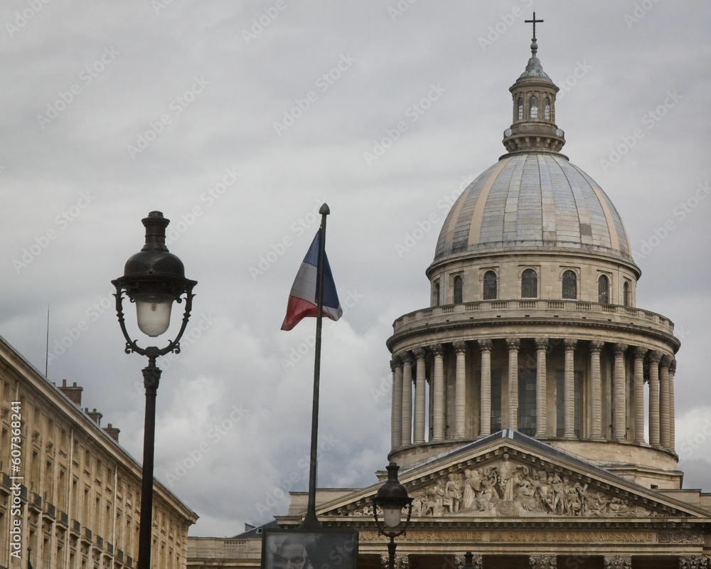Dome of the Pantheon historical monument in Paris, France captured against the grey cloudy sky