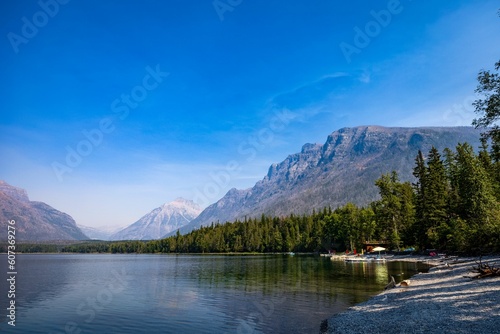 Scenic view of a lake shore during daytime in Glacier National Park, Montana