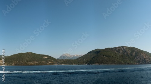 Wallpaper Mural Seascape view at sunrise with misty mountains and clear sky background Torontodigital.ca