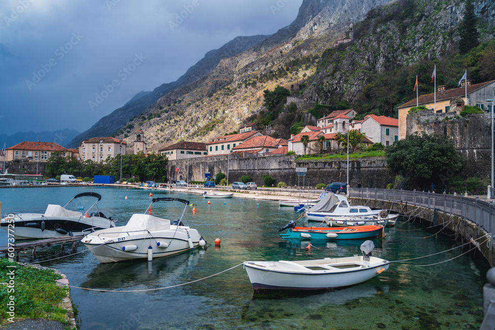 Kotor old city, travel to Montenegro and the Balkans. View of the city and the bay with boats