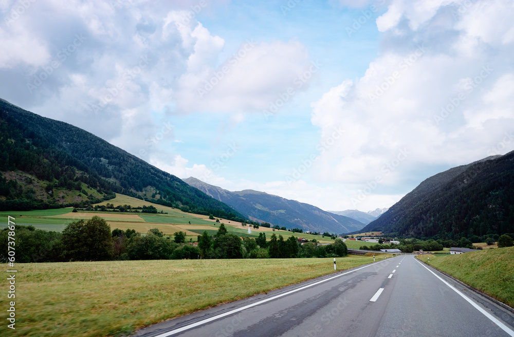 Fototapeta premium Asphalt road in Alp mountains. Road trip concept. Beautiful landscape.