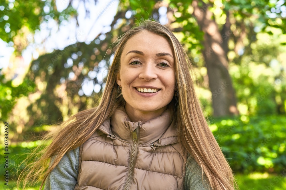 Seizing the day, her smile to the camera radiates joy in the park. Seizing the day, her smile to the camera radiates joy in the park.