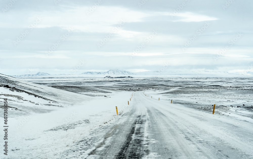 Winter snow road in Iceland with mountains