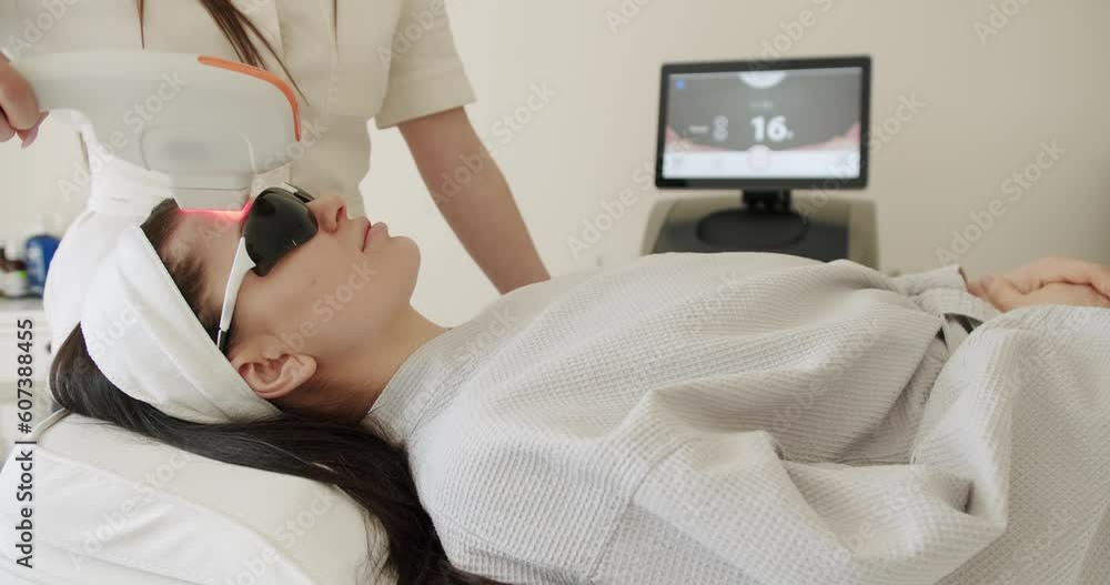 Facial rejuvenation, beauty woman with protective glasses, aesthetic medicine is performing procedure. Woman getting LPG hardware massage at the beauty clinic. Beauty treatment. Facial rejuvenation, beauty woman with protective glasses, aesthetic medicine is performing procedure. Woman getting LPG hardware massage at the beauty clinic. Beauty treatment.