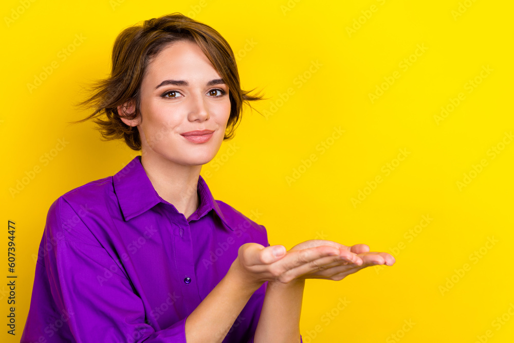 Photo of young businesswoman wear stylish shirt hands demonstrate her company product cheap idea creation isolated on yellow background Photo of young businesswoman wear stylish shirt hands demonstrate her company product cheap idea creation isolated on yellow background