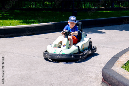 a boy on a children's go-kart