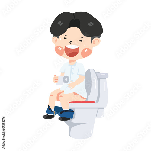 Cute boy child sitting on toilet with paper roll in hand