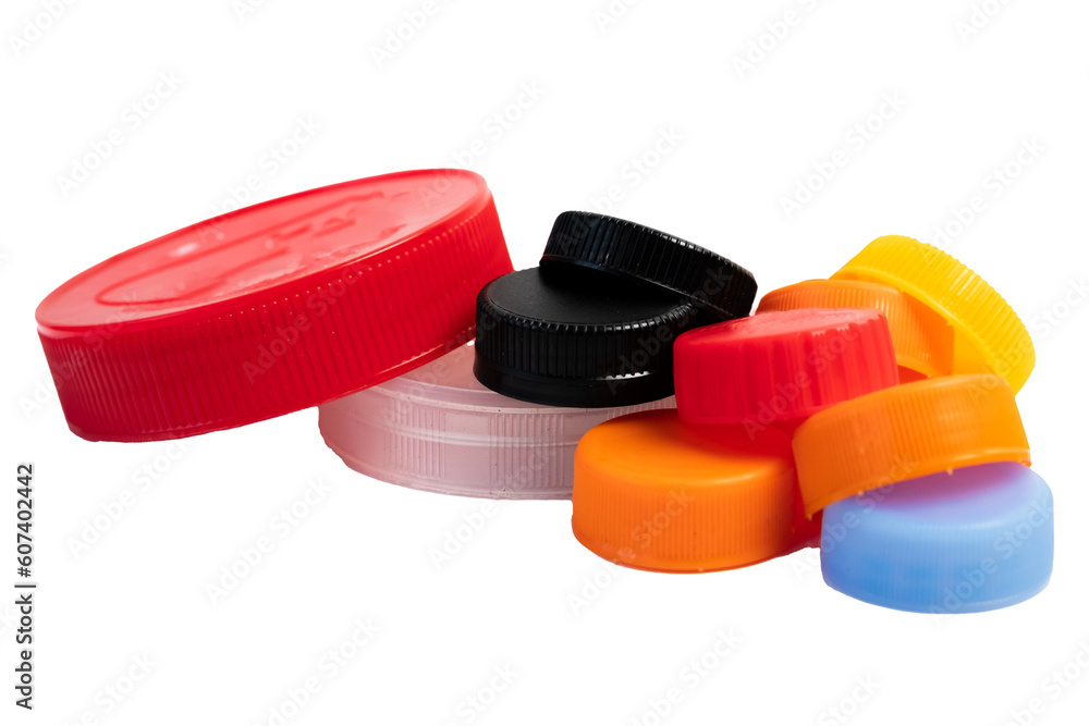 A pile of plastic bottle caps and jars isolated on white. Recyclable