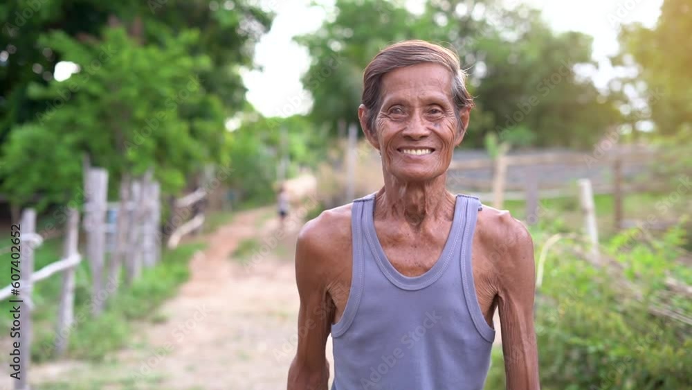 Slow motion scene Asian elderly man happy smile at you outdoor Slow motion scene Asian elderly man happy smile at you outdoor