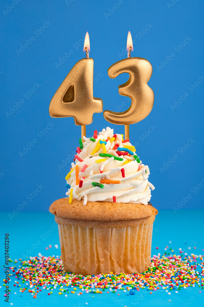 Birthday cake with candle number 43 - Blue background