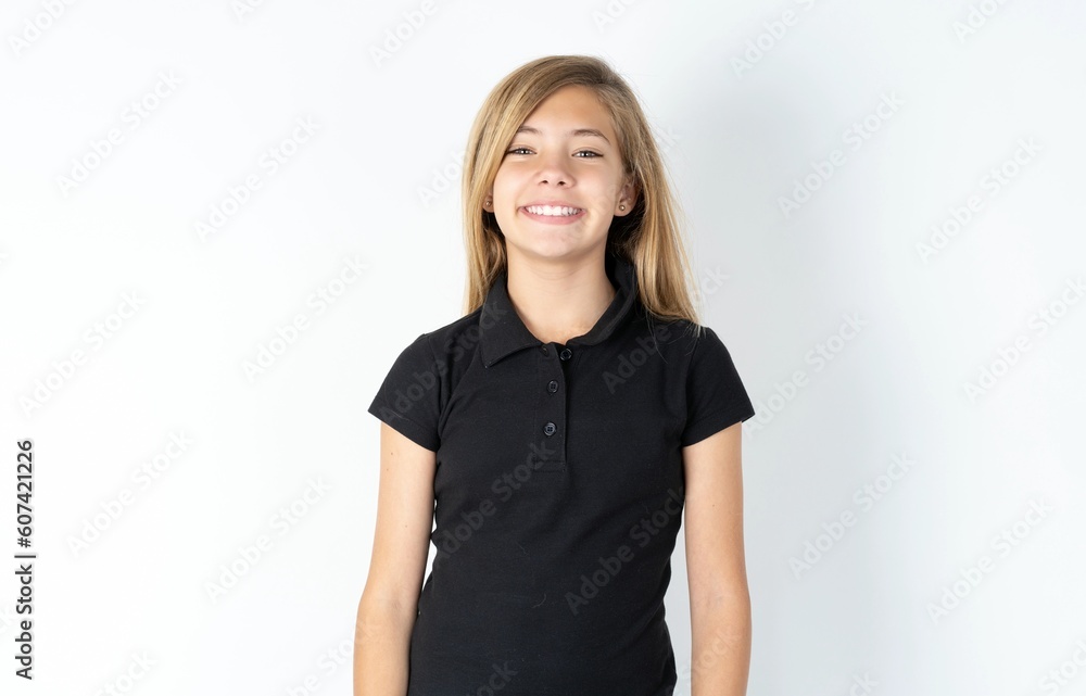 Close up photo of beautiful teen girl wearing black dress over white studio background toothy smiling Close up photo of beautiful teen girl wearing black dress over white studio background toothy smiling