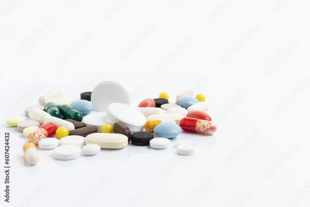 Pack of pills and different pills and capsules on a white background with space for text Pack of pills and different pills and capsules on a white background with space for text