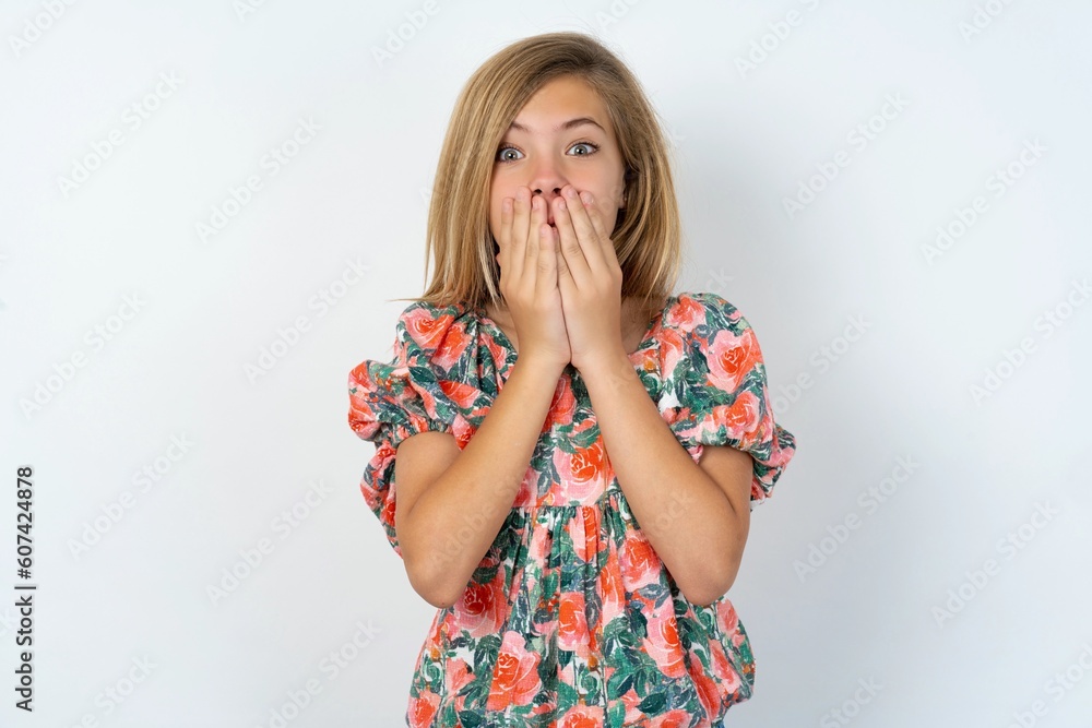 Vivacious teen girl , giggles joyfully, covers mouth, has natural laughter, hears positive story or funny anecdote
