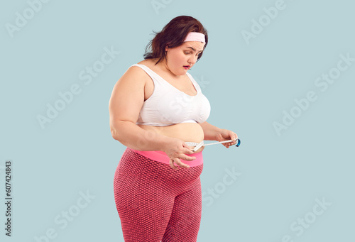 Cuadro en lienzo Woman finds out she has gained weight and has fat belly