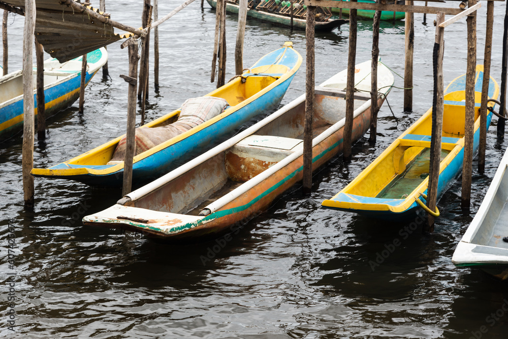 Fishing canoes docked on the Almas River in the city of Taperoa, Bahia.