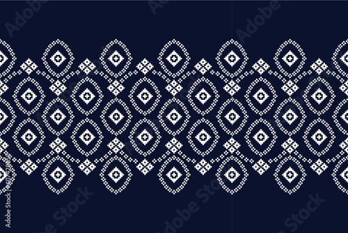 Ethnic geometric fabric pattern Cross Stitch.Ikat embroidery Ethnic oriental Pixel pattern navy blue background. Abstract,vector,illustration. Texture,clothing,scarf,decoration,motifs,silk wallpaper.