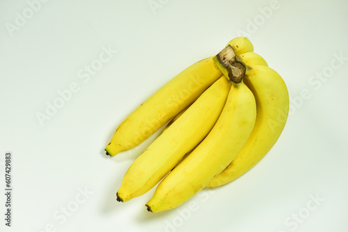 Close up close up bunch of yellow ripe bananas on white background. healthy fruit concept, fresh fruit, fattening, yellow banana background, tropical fruits