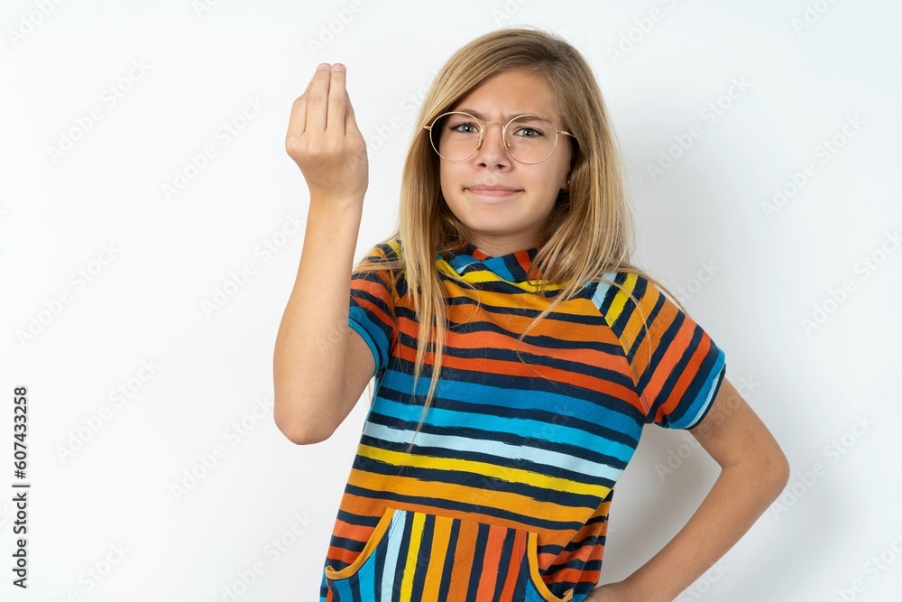 What the hell are you talking about. Shot of frustrated beautiful caucasian teen girl gesturing with raised hand doing Italian gesture, frowning, being displeased and confused with dumb question. What the hell are you talking about. Shot of frustrated beautiful caucasian teen girl gesturing with raised hand doing Italian gesture, frowning, being displeased and confused with dumb question.