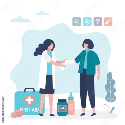 Female doctor provides first aid to the injured woman. Unhappy patient with fracture or injury to the arm, nurse applies bandage or plaster. Emergency, traumatology,