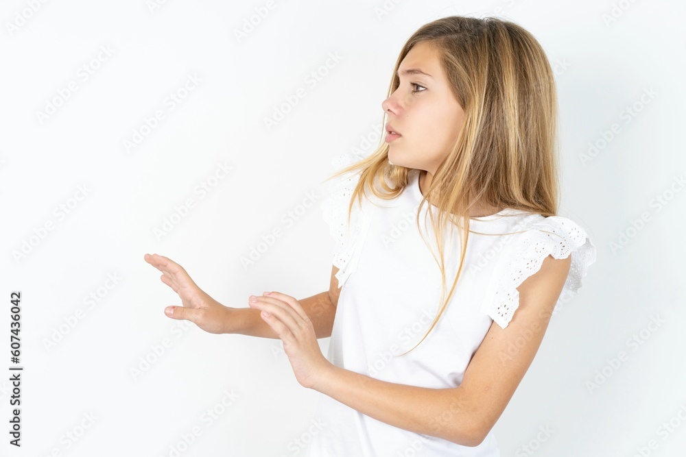 Displeased MODEL keeps hands towards empty space and asks not come closer sees something unpleasant Displeased MODEL keeps hands towards empty space and asks not come closer sees something unpleasant