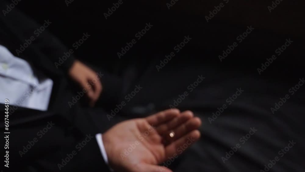 Groom throws up and holding wedding rings close up several times. Slow motion Groom throws up and holding wedding rings close up several times. Slow motion