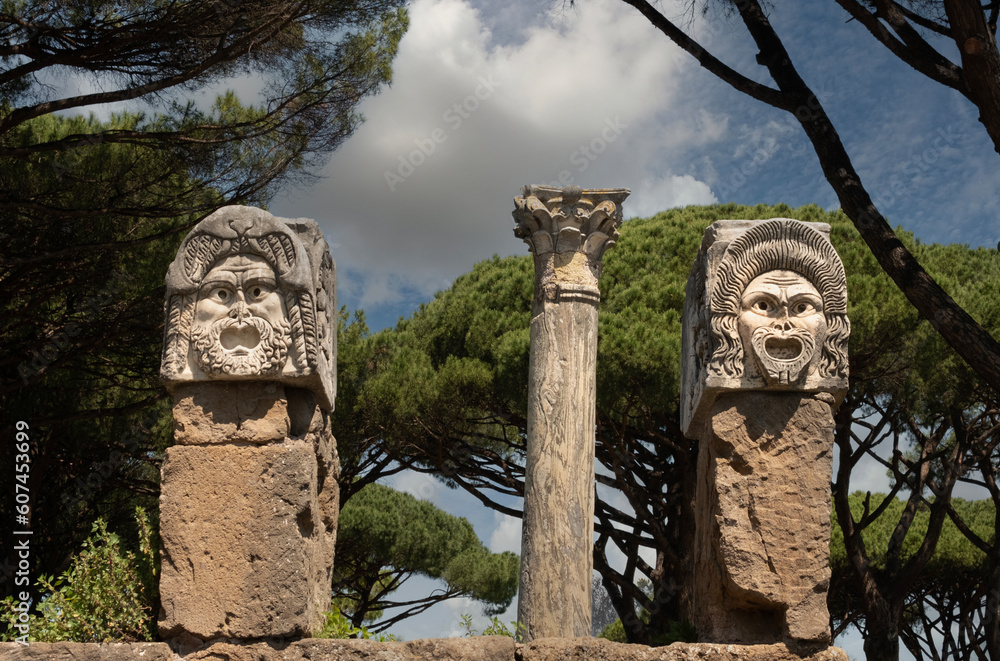 Obraz premium Stone theater masks - decoration of the amphitheater in Ostia Antica, Rome