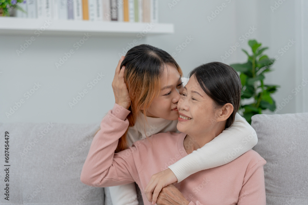 Mother day, cute asian teen girl hugging and kissing on the cheek, mature middle age mum. Love, kiss, care, happy smile enjoy family time. celebrate special occasion, happy birthday, merry Christmas. Mother day, cute asian teen girl hugging and kissing on the cheek, mature middle age mum. Love, kiss, care, happy smile enjoy family time. celebrate special occasion, happy birthday, merry Christmas.