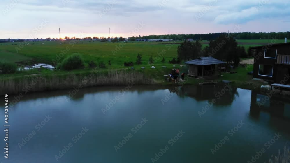 Guys having fun by bbq grill together drink alcohol and enjoy summer evening at dusk. Togetherness and brotherhood concept. Guys having fun by bbq grill together drink alcohol and enjoy summer evening at dusk. Togetherness and brotherhood concept.