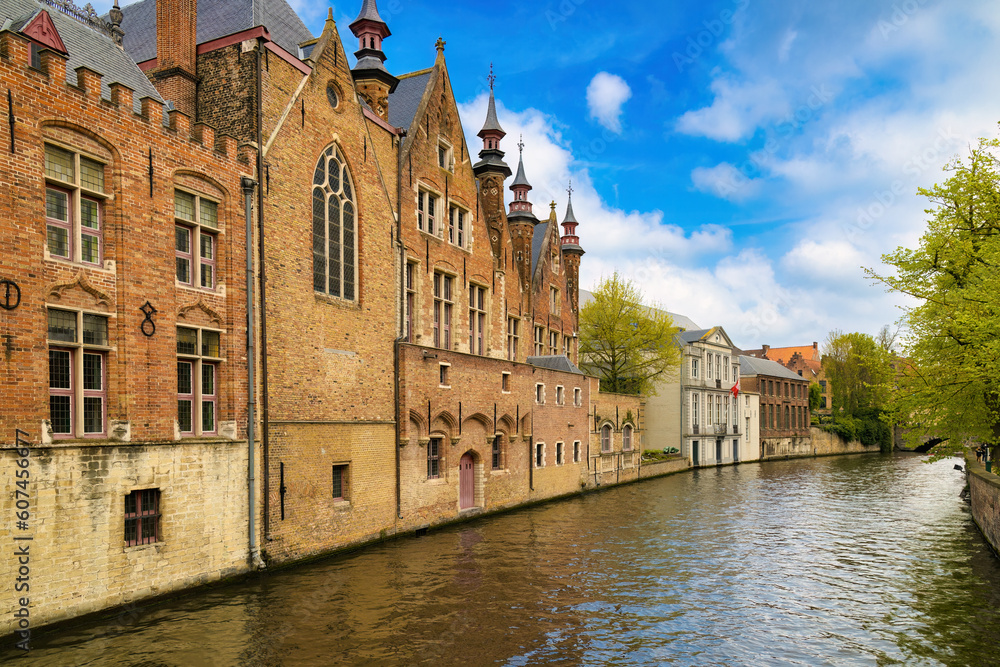 Perspective of the typical houses that surround the canals of the historic center of Bruges, Belgium.