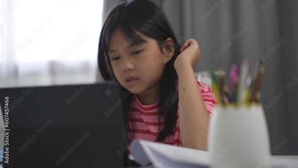 asian child student enjoy studying online class on computer tablet or kid girl video call learning and smiling study talking to write or people learn from home school on pad by education technology asian child student enjoy studying online class on computer tablet or kid girl video call learning and smiling study talking to write or people learn from home school on pad by education technology