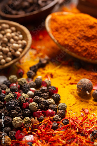 Pepper spice mix and variety of spices at table background. Cooking food ingredients