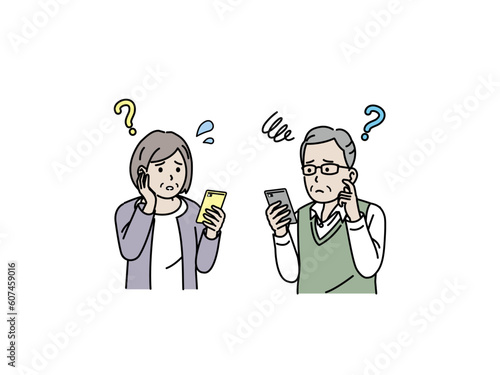 スマートフォンの操作がわからず困る高齢者、老夫婦
