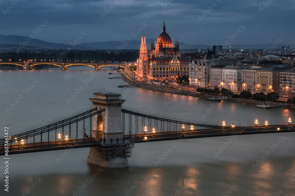 Fototapeta premium The magnificent Hungarian Parliament building on the banks of the Danube River. The majestic monumental building at night. Beautiful lighting.