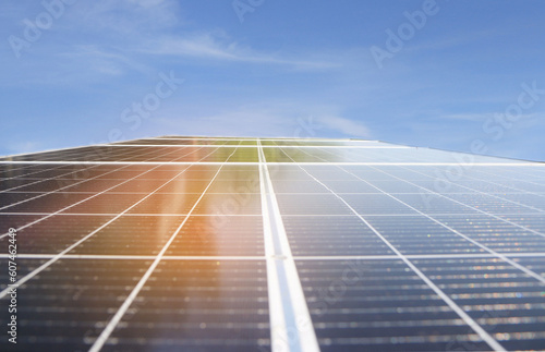 Solar panels on the blue sky  under the concept of alternative electricity sources for the environment.