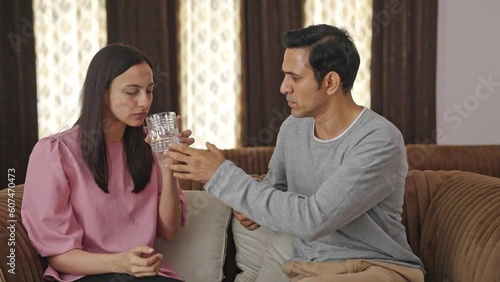 Indian husband taking care of sick wife